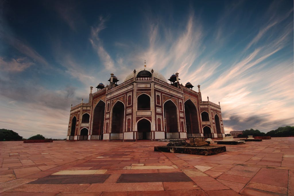 Brown and Black Mosque Under White and Blue Cloudy Sky